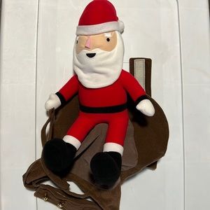 Santa Claus that rides on the back of a dogs back outfit